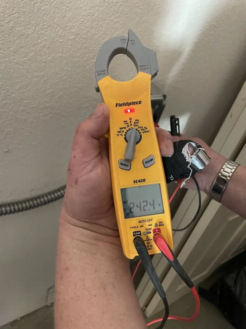 Voltage testing with clamp meter during Generator Installation in Wilton Manors